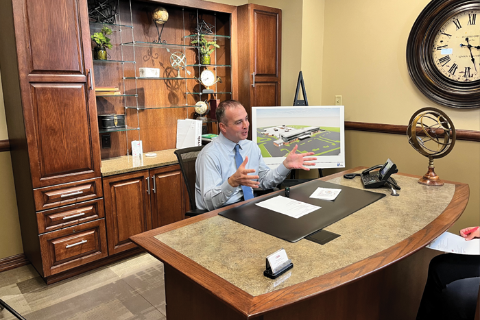 Michael Calhoun, CEO, at his desk 