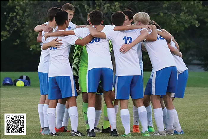 Athletes in a huddle