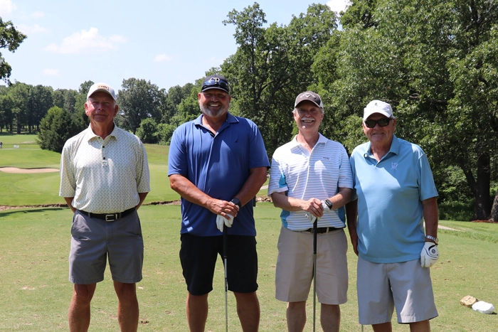 Four golfers on tee box at CMH Foundation Medical Excellence Golf Classic