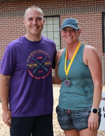 Michael Calhoun, CEO/Executive Director and 10K age division winner, Kim Graves. 