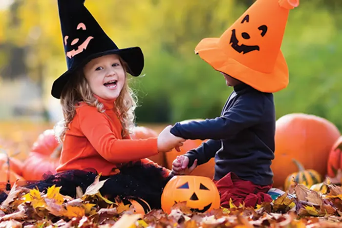 Girl and boy dressed up for Halloween